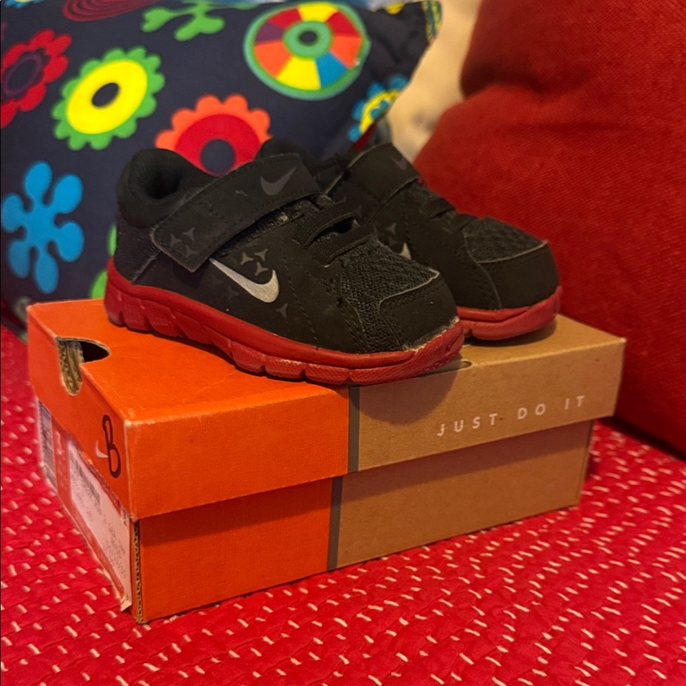 Nike Kids Black Sneakers with Red Soles